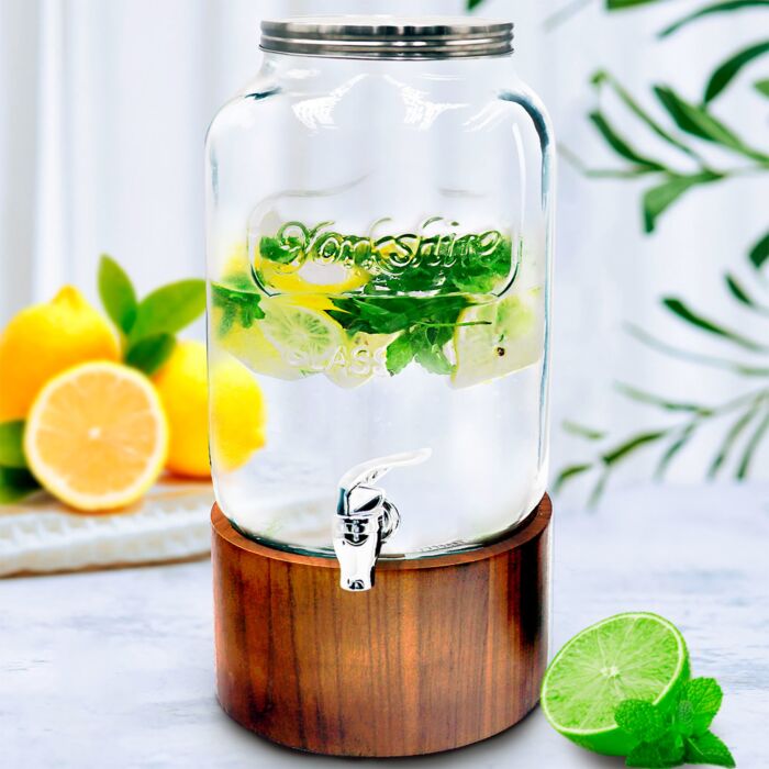 Distributeur de boissons en verre avec robinet, sur socle en bois